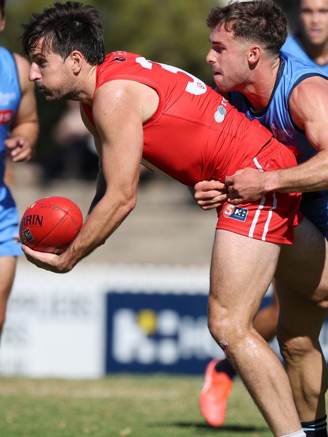 North Adelaide’s Sam Mayes is tackled by Sturt’s Will Snelling at Prospect Oval in Round 3. Picture: David Mariuz/SANFL