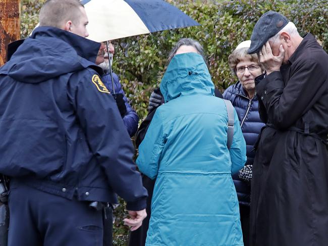 People gather on a corner near the Tree of Life Synagogue in Pittsburgh. Picture: AP