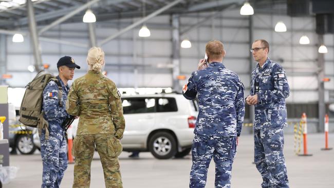 ADF personnel assist with a COVID-19 testing at Melbourne Showgrounds Photo: Darrian Traynor/Getty Images