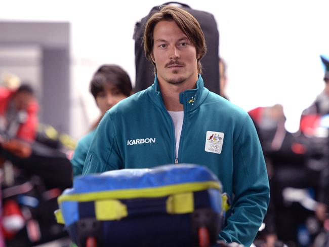 Australia's Alex Pullin arrives at the airport for the XXII Olympic Winter Games in Sochi, Russia, Wednesday, Feb. 5, 2014. (AAP Image/Paul Miller) NO ARCHIVING