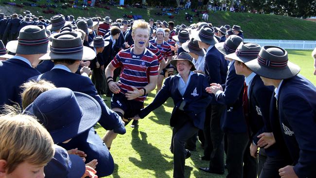 The Southport School side run onto the field earlier in the season. Picture AAP/David Clark