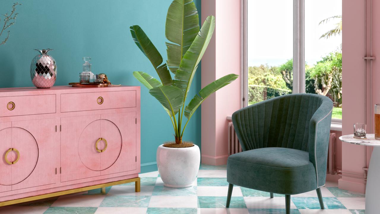 Tropical living room design with shades of Millennial pink and teal. Picture: iStock