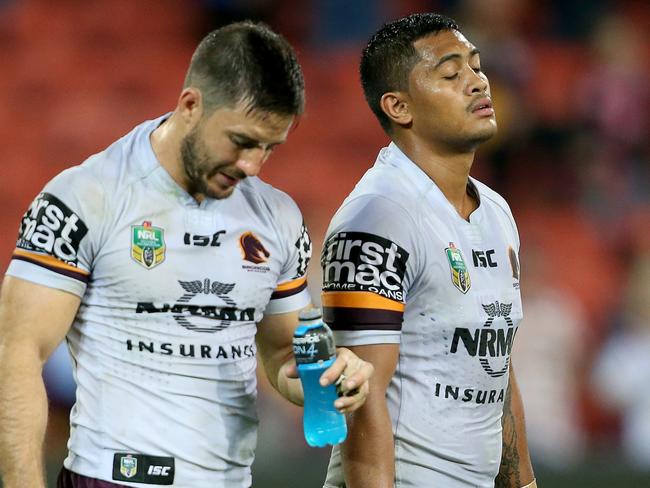 Ben Hunt and Anthony Milford of the Broncos look dejected after losing the round 25 NRL game between the Brisbane Broncos and the Parramatta Eels at Suncorp Stadium in Brisbane, Thursday, August 24, 2017. (AAP Image/Jono Searle) NO ARCHIVING, EDITORIAL USE ONLY