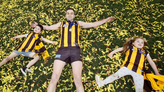 Lake celebrates the 2014 grand final win with his kids. Picture: David Caird.