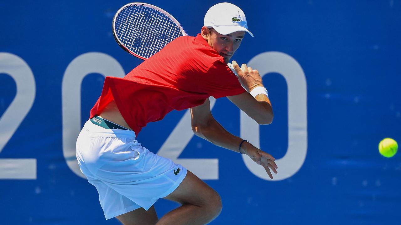 Russia's Daniil Medvedev returns to Kazakhstan's Alexander Bublik during their Tokyo 2020 Olympic Games men's singles first round tennis match. (Photo by Tiziana FABI / AFP)