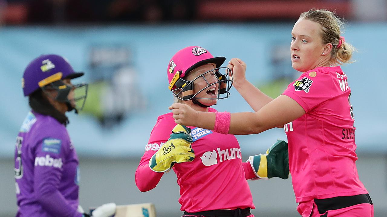 Hayley Silver-Holmes celebrates with Sixers teammate Alyssa Healy in 2020.