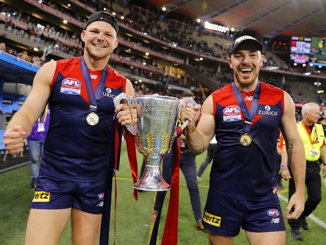 Hibberd (right) played in Melbourne’s first premiership victory since 1964. Picture: Dylan Burns/AFL Photos via Getty Images