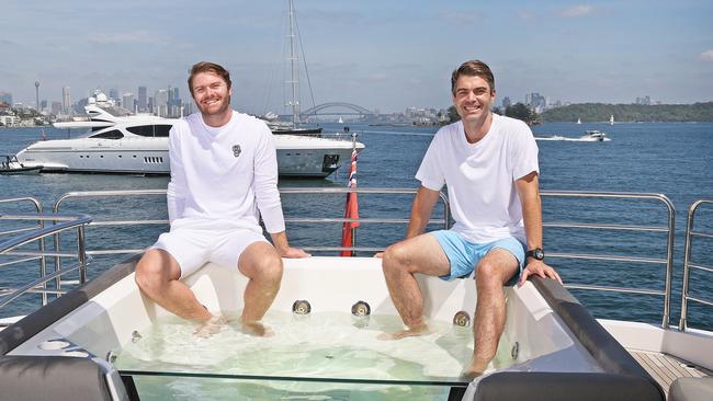 Warwick brothers Kain (right) and Kieran, aboard Kain’s boat on Sydney Harbour. Picture: Toby Zerna