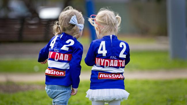 Delphi and Cheska Picken with dad Liam's number on their backs. Picture: Nathan Dyer