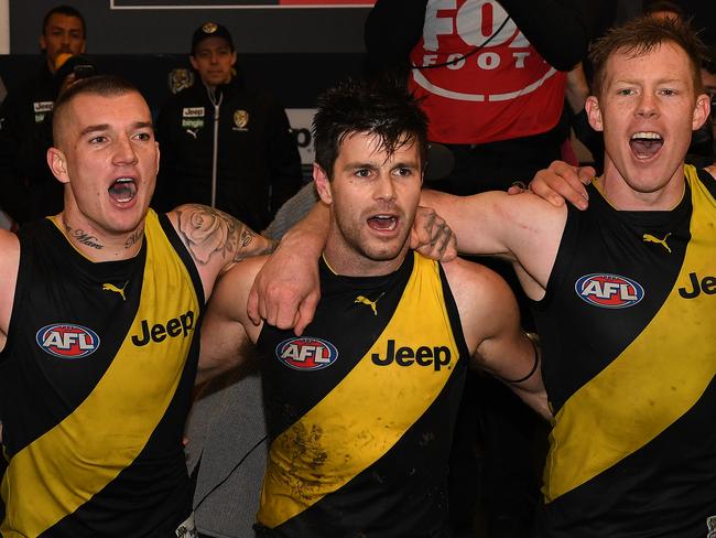 (L-R) Dustin Martin, Trent Cotchin and Jack Riewoldt of the Tigers react after winning the Round 18 AFL match between the Richmond Tigers and the Greater Western Sydney Giants at the MCG in Melbourne, Sunday, July 23, 2017. (AAP Image/Julian Smith) NO ARCHIVING, EDITORIAL USE ONLY