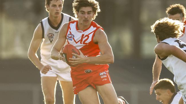 Zavier Maher runs with the ball for the Young Guns. Picture: Daniel Pockett/AFL Photos/via Getty Images