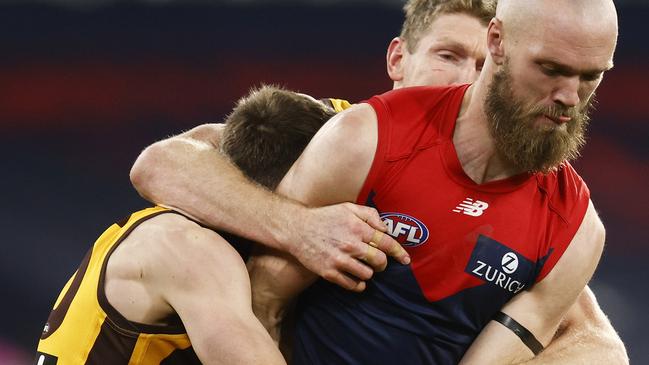 Big Demon Max Gawn is gang tackled Ben McEvoy (centre) and Liam Shiels.