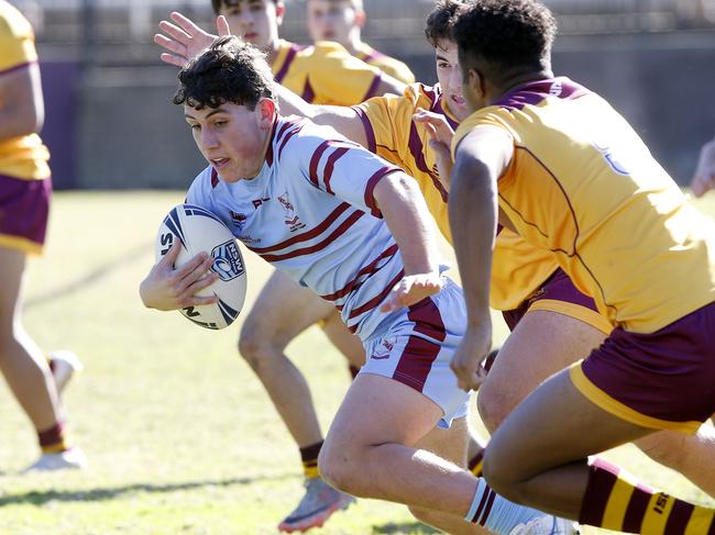 St Greg's Luke Cannon with the ball. NRL Schoolboys Rugby League. Holy Cross College (Yellow and maroon ) v St Gregory's College (blue and maroon). at Holy Cross College, Ryde. Picture: John Appleyard