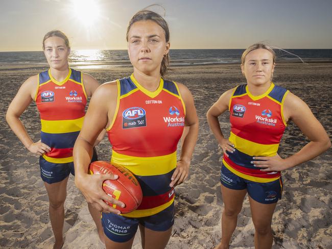 Crows players Caitlin Gould, Ebony Marinoff and Hannah Munyard are set for summer. Picture: SIMON CROSS