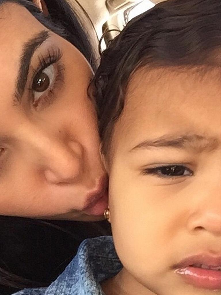 That time she protested against selfies... “I don’t know if she’s annoyed with my million daily kisses or my alien face” Picture: Kim Kardashian/Instagram