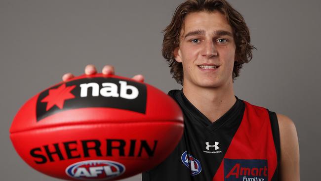 Harry Jones tries on the red and black as an Essendon player.