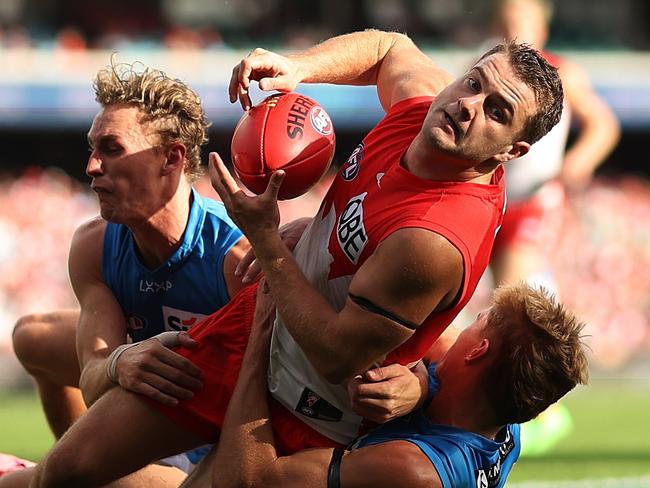 Tom Papley looks to get the handball out of the pack against the Suns. Picture: Mark Metcalfe/AFL Photos/via Getty Images.