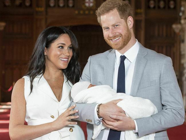 The couple with their newborn Archie last year. Picture: AP