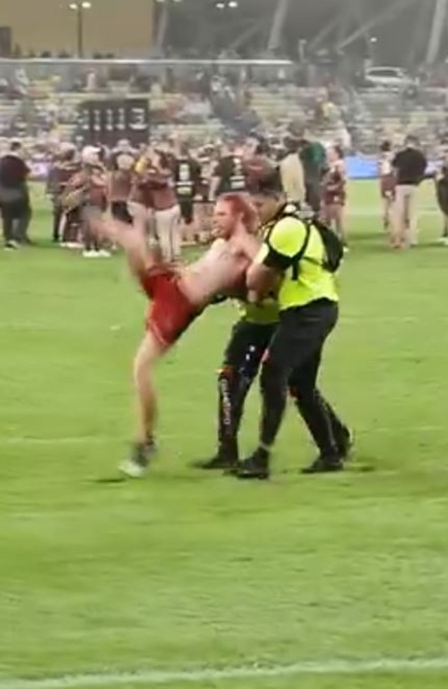 A Vincent man, 24, has been charged after he ran onto the field at the Townsville Women's State of Origin decider.