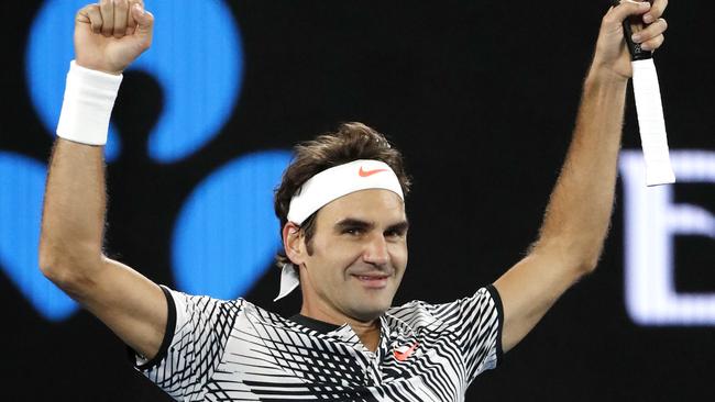 Switzerland's Roger Federer celebrates after defeating Germany's Mischa Zverev during their quarterfinal at the Australian Open. (AP Photo/Dita Alangkara)