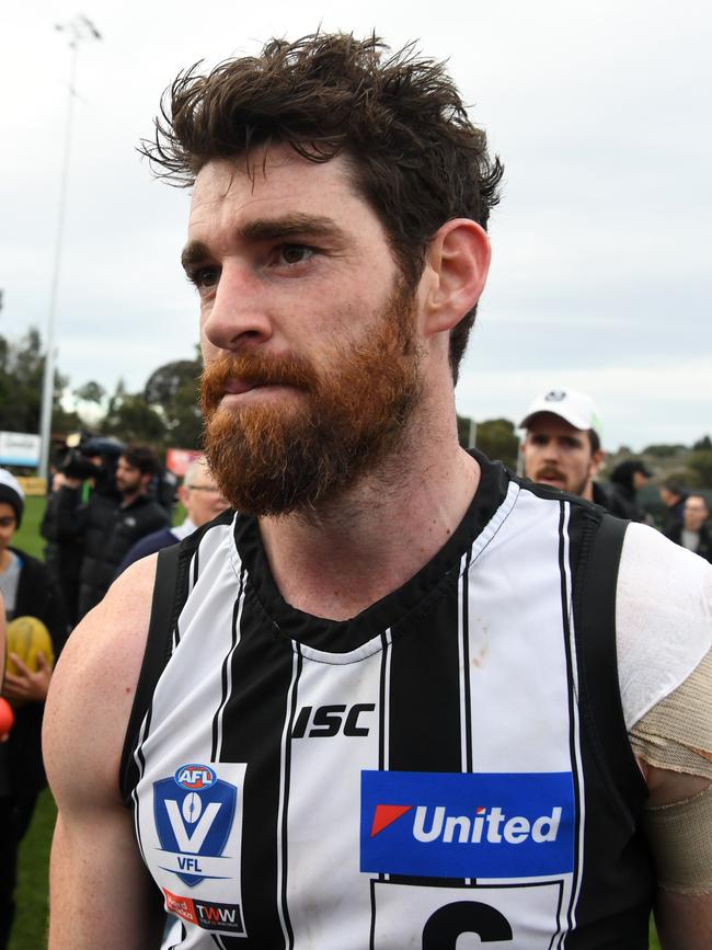 Tyson Goldsack leaves the field following the round 21 VFL match, his last game before retiring from Collingwood. Picture: AAP/James Ross