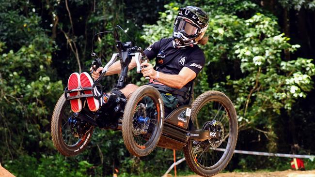 Grant Allen test rides an adaptive mountain bike for all abilities on the slalom track on Day Two of the Crankworx Cairns mountain bike festival, held at the Smithfield Mountain Bike Park. Picture: Brendan Radke