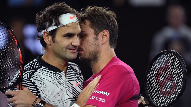 Roger Federer is congratulated by Stan Wawrinka after their Australian Open semi-final. (AAP Image/Tracey Nearmy)