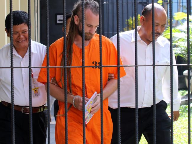 David Taylor is escorted from his cell at Denpasar Police Station. Picture: Lukman S. Bintoro.