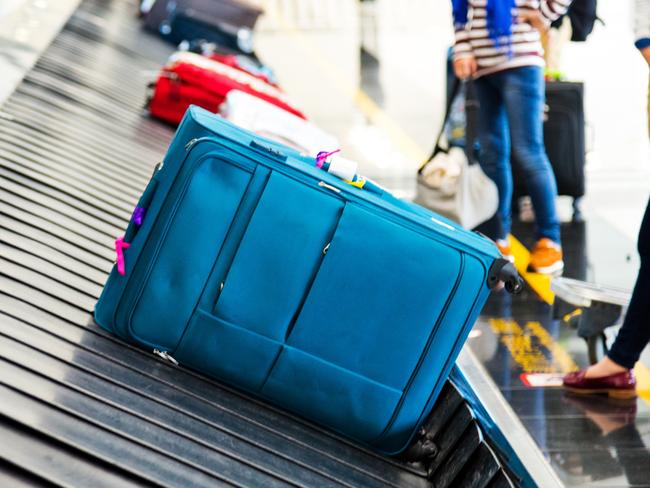 Luggages moving on airport conveyor belt. Picture: iStockDoc Holiday, Escape