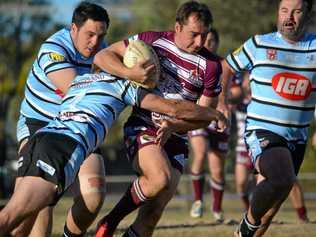 Matt Foster, from Wallumbilla/Surat Red Bulls, get caught by a Devils player. Picture: Molly Hancock