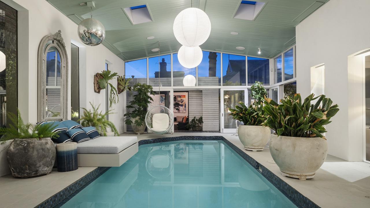 The spectacular indoor pool featuring a disco ball and day bed — the centrepiece of the home.