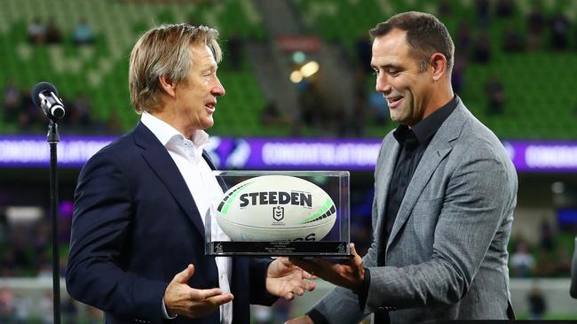 MELBOURNE, AUSTRALIA - MARCH 17: Craig Bellamy, Head Coach of the Storm receives the game ball from Cameron Smith after coaching his 500th NRL game during the round two NRL match between the Melbourne Storm and the South Sydney Rabbitohs at AAMI Park, on March 17, 2022, in Melbourne, Australia. (Photo by Kelly Defina/Getty Images)