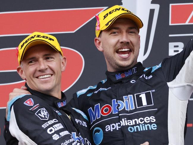 DAILY TELEGRAPH. DECEMBER 5, 2021.Pictured is Lee Holdsworth and Chaz Mostert celebrating on the podium after winning the Repco Bathurst 1000 at Mount Panorama today. Picture: Tim Hunter.