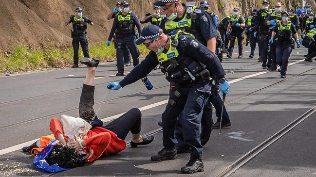 A woman was allegedly knocked down and capsicum sprayed by police during a wild protest. Picture: Jason Edwards