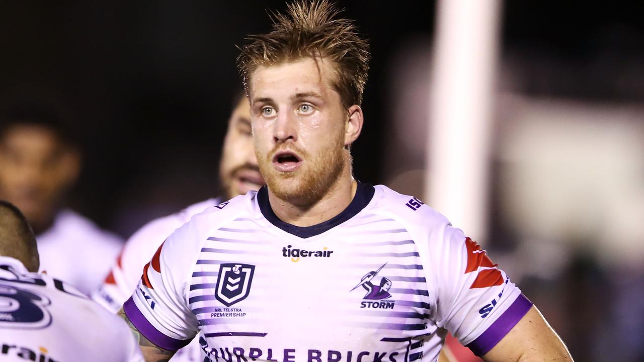 Cameron Munster of the Storm looks dejected after a Sharks try.