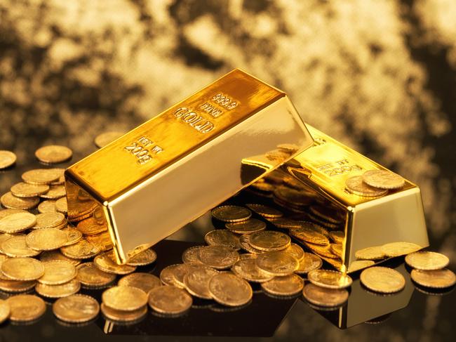 Gold bars and gold coins for wealth