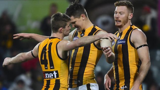 Ollie Hanrahan, Mitchell Lewis and Tim O’Brien celebrate a goal. Picture: AAP