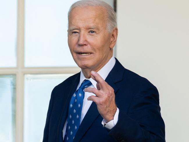 US President Joe Biden crosses his fingers as he answers a question about a Gaza ceasefire after speaking in the Rose Garden of the White House. Picture: AFP