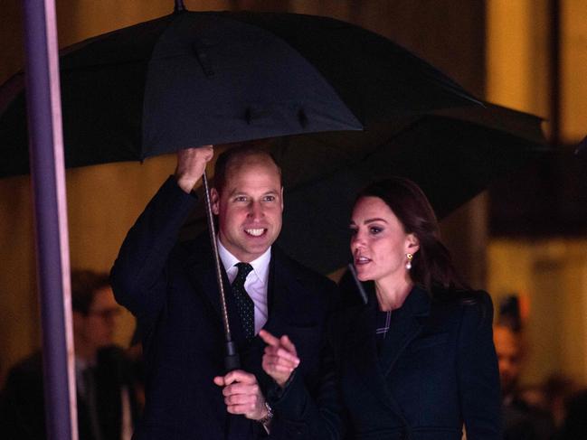 Prince William and Catherine shelter under an umbrella as they arrive for Earthshot celebrations at City Hall Plaza in Boston. Picture: AFP.