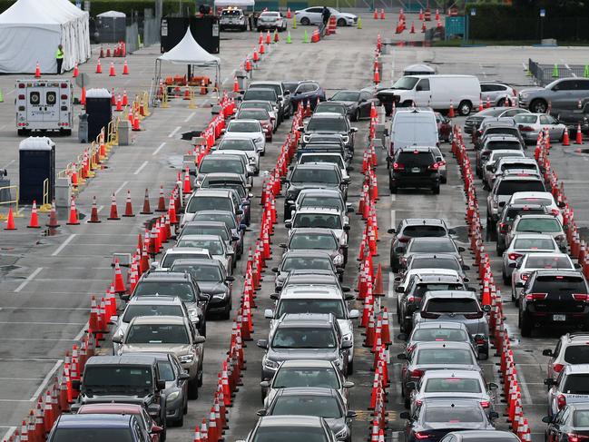 Cars are seen as the drivers wait to be tested for COVID-19. Picture: Getty Images