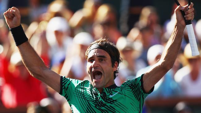 Roger Federer celebrates match point against Stan Wawrinka.