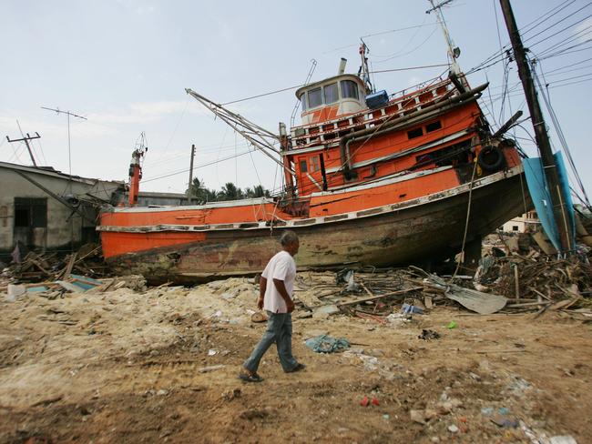 Ships out of water. This fishing trawler embedded itself in a house in Phuket. Picture: Gary Ramage