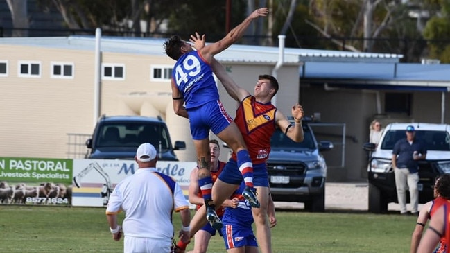 Alex Radak (left) skies for a tap. Picture: Facebook