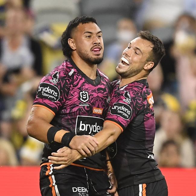 Kelma Tuilagi (L) celebrates after scoring a try during the round 22 NRL match between the North Queensland Cowboys and the Wests Tigers. Picture: Ian Hitchcock/Getty Images