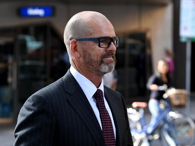 Former Victoria Police Chief Commissioner Simon Overland departs the Royal Commission into the Management of Police Informants at the Fair Work Commission in Melbourne, Tuesday, January 21, 2020. (AAP Image/James Ross) NO ARCHIVING