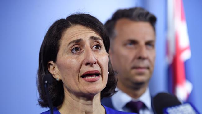 NSW Premier Gladys Berejiklian stands beside NSW Transport and Infrastructure Minister Andrew Constance during a press conference regarding the Sydney Trains strike last week.