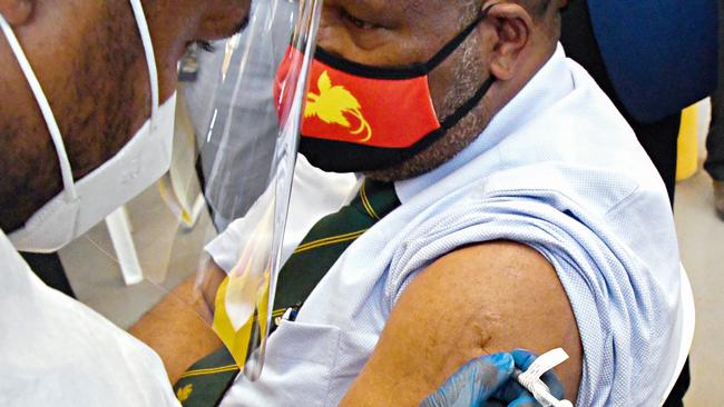 PNG PM James Marape receives a Covid-19 vaccine in March. Picture: AFP