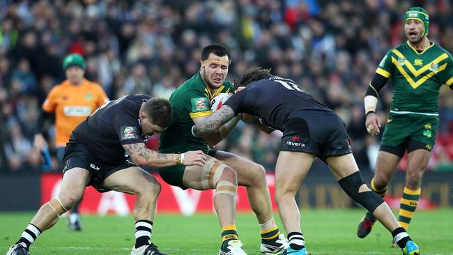 Australia's David Klemmer in action against New Zealand's Greg Eastwood and Kevin Proctor.