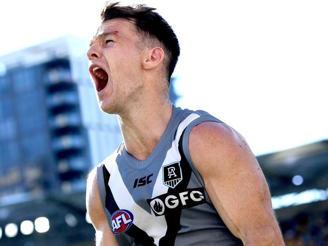 BRISBANE, AUSTRALIA - JULY 19: Robbie Gray of Port Adelaide celebrates kicking the match winning goal during the round 7 AFL match between the Carlton Blues and the Port Adelaide Power at The Gabba on July 19, 2020 in Brisbane, Australia. (Photo by Bradley Kanaris/Getty Images)