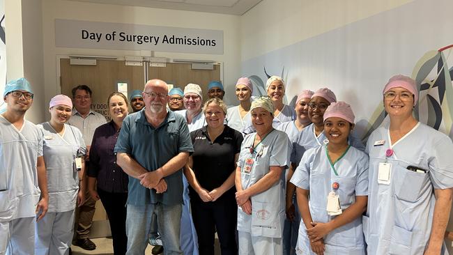 Wayne Scott (centre, with medical staff) was the first patient at the new $42m Toowoomba day surgery at Baillie Henderson Hospital.